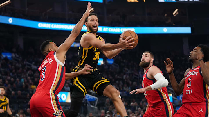 Golden State Warriors guard Stephen Curry (30) attempts a shot next to New Orleans Pelicans guard CJ McCollum (3) in the first quarter at the Chase Center. Mandatory Credit: Cary Edmondson-Imagn Images