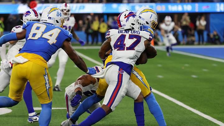 Dec 23, 2023; Inglewood, California, USA; Buffalo Bills cornerback Christian Benford (47) tackles Los Angeles Chargers wide receiver Quentin Johnston (1) during the third quarter at SoFi Stadium. Dec 23, 2023; Inglewood, California, USA; Buffalo Bills cornerback Christian Benford (47) tackles Los Angeles Chargers wide receiver Quentin Johnston (1) during the third quarter at SoFi Stadium.