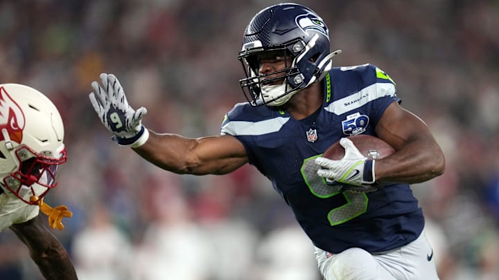 Seattle Seahawks running back Kenneth Walker III (9) attempts to stiff arm Arizona Cardinals cornerback Kei'Trel Clark (13) at State Farm Stadium in Glendale on Sept. 25, 2025.