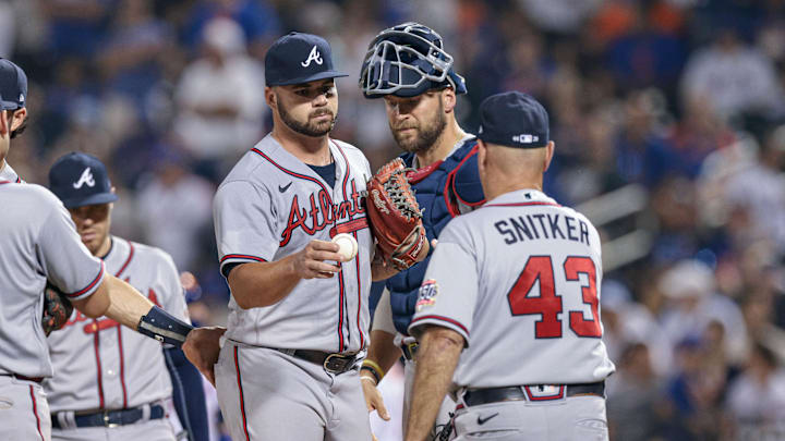 Jul 26, 2021; New York City, New York, USA; Atlanta Braves relief pitcher Bryse Wilson (46) hands the ball to manager Brian Snitker (43) during the fourth inning against the New York Mets at Citi Field. Mandatory Credit: Vincent Carchietta-Imagn Images