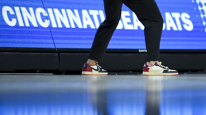 Dec 14, 2024; Cincinnati, Ohio, USA; The Nike shoes worn by Cincinnati Bearcats head coach Wes Miller are seen as he works the bench against the Xavier Musketeers in the second half at Fifth Third Arena. Mandatory Credit: Aaron Doster-Imagn Images Dec 14, 2024; Cincinnati, Ohio, USA; The Nike shoes worn by Cincinnati Bearcats head coach Wes Miller are seen as he works the bench against the Xavier Musketeers in the second half at Fifth Third Arena. Mandatory Credit: Aaron Doster-Imagn Images