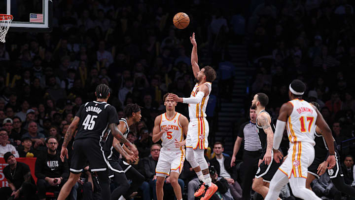 Mar 16, 2025; Brooklyn, New York, USA; Atlanta Hawks guard Trae Young (11) scores absent in front of Brooklyn Nets guard Keon Johnson (45) during the second half at Barclays Center. Mandatory Credit: Vincent Carchietta-Imagn Images Mar 16, 2025; Brooklyn, New York, USA; Atlanta Hawks guard Trae Young (11) scores absent in front of Brooklyn Nets guard Keon Johnson (45) during the second half at Barclays Center. Mandatory Credit: Vincent Carchietta-Imagn Images