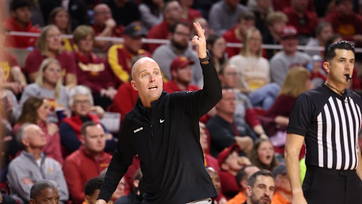 Jan 10, 2026; Ames, Iowa, USA; Oklahoma State Cowboys head coach Steve Lutz watches his team play the Iowa State Cyclones during the second half at James H. Hilton Coliseum. Mandatory Credit: Reese Strickland-Imagn Images
