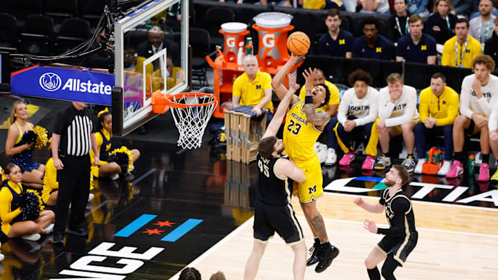 Mar 15, 2026; Chicago, IL, USA; Michigan Wolverines forward Yaxel Lendeborg (23) takes a shot a Purdue Boilermakers center Oscar Cluff (45) defends during the second half during the men's Big Ten Conference Tournament Championship at United Center. Mandatory Credit: Kamil Krzaczynski-Imagn Images