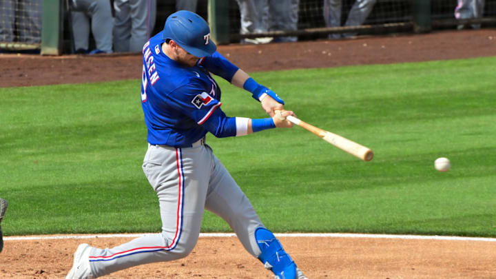Feb 23, 2026; Tempe, Arizona, USA;  Texas Rangers catcher Danny Jansen (9) grounds out in the third inning against the Los Angeles Angels during a spring training game at Tempe Diablo Stadium. Mandatory Credit: Matt Kartozian-Imagn Images