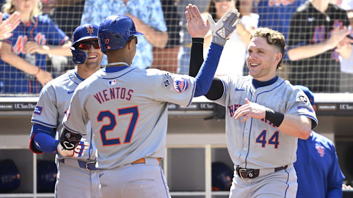 Aug 25, 2024; San Diego, California, USA; New York Mets third baseman Mark Vientos (27) is congratulated by center fielder Harrison Bader (44) after hitting a home run against the San Diego Padres during the seventh inning at Petco Park. Mandatory Credit: Orlando Ramirez-Imagn Images