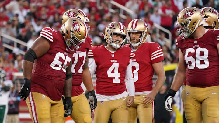 Sep 9, 2024; Santa Clara, California, USA; San Francisco 49ers place kicker Jake Moody (4) celebrates with guard Aaron Banks (65), guard Dominick Puni (77), punter Mitch Wishnowsky (3), and offensive tackle Colton McKivitz (68) during the fourth quarter against the New York Jets at Levi's Stadium. Mandatory Credit: David Gonzales-Imagn Images