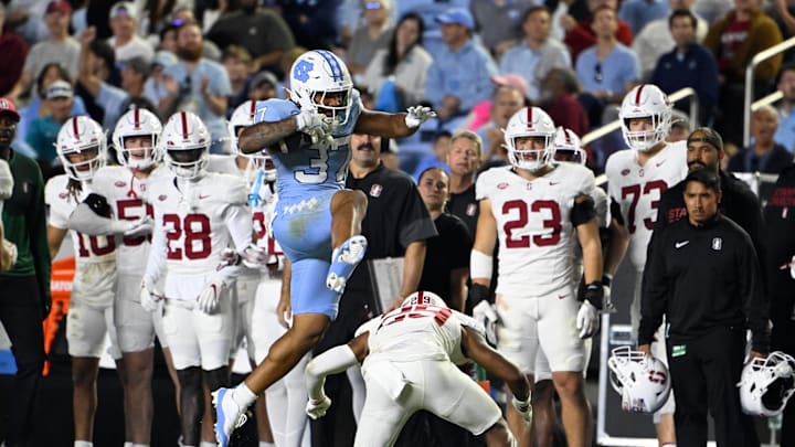 Nov 8, 2025; Chapel Hill, North Carolina, USA; North Carolina Tar Heels running back Davion Gause (37) jumps overStanford Cardinal safety Darrius Davis (29) in the third quarter at Kenan Stadium. Mandatory Credit: Bob Donnan-Imagn Images Nov 8, 2025; Chapel Hill, North Carolina, USA; North Carolina Tar Heels running back Davion Gause (37) jumps overStanford Cardinal safety Darrius Davis (29) in the third quarter at Kenan Stadium. Mandatory Credit: Bob Donnan-Imagn Images