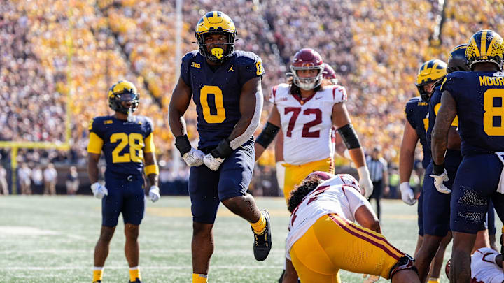 Michigan defensive end Josaiah Stewart (0) celebrates a tackle against USC during the first half at Michigan Stadium in Ann Arbor on Saturday, Sept. 21, 2024.