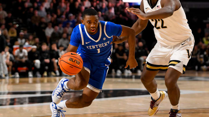 Jan 25, 2025; Nashville, Tennessee, USA;  Kentucky Wildcats guard Lamont Butler (1) drives to the basket past Vanderbilt Commodores forward Jaylen Carey (22) during the second half at Memorial Gymnasium. Mandatory Credit: Steve Roberts-Imagn Images