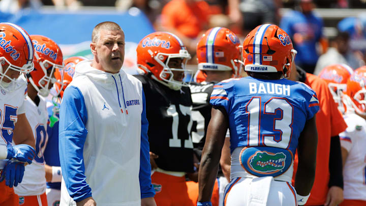 Apr 12, 2025; Gainesville, FL, USA; Florida Gators head coach Billy Napier looks on while Florida Gators running back Jadan Baugh (13) walks by before the game at Ben Hill Griffin Stadium. Mandatory Credit: Matt Pendleton-Imagn Images