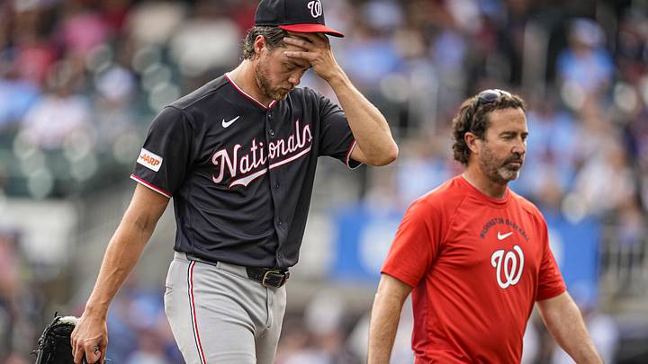 May 23, 2026; Cumberland, Georgia, USA; Washington Nationals pitcher Jake Irvin (27) leaves the game before throwing a pitch against the Atlanta Braves while throwing a no hit game during the sixth inning at Truist Park. Mandatory Credit: Dale Zanine-Imagn Images