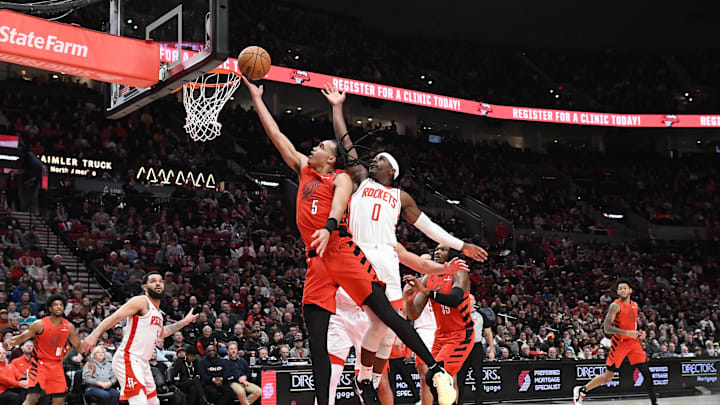 Jan 18, 2025; Portland, Oregon, USA; Portland Trail Blazers forward Delano Banton (5) shoots over Houston Rockets guard Aaron Holiday (0) during the second half at Moda Center. Mandatory Credit: Brian Murphy-Imagn Images Jan 18, 2025; Portland, Oregon, USA; Portland Trail Blazers forward Delano Banton (5) shoots over Houston Rockets guard Aaron Holiday (0) during the second half at Moda Center. Mandatory Credit: Brian Murphy-Imagn Images
