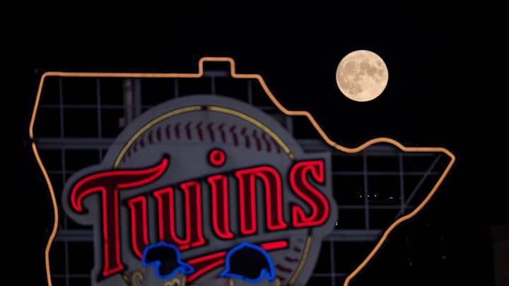 A full moon rises over the Minnesota Twins logo in a game between the Minnesota Twins and Chicago White Sox at Target Field in Minneapolis on Sept. 1, 2020.