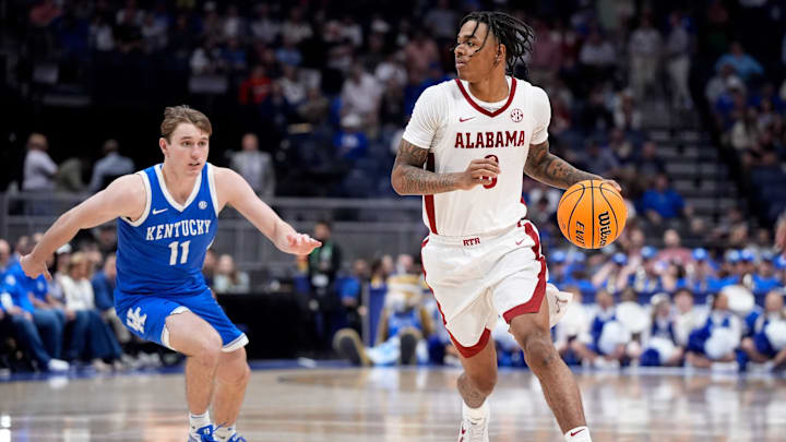 Alabama guard Labaron Philon (0) moves the ball past Kentucky guard Travis Perry (11) during the second half of a Southeastern Conference tournament quarterfinal game at Bridgestone Arena in Nashville, Tenn., Friday, March 14, 2025.
