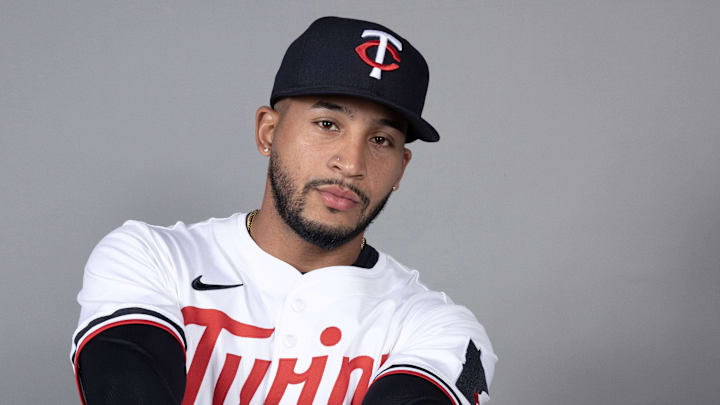 Feb 21, 2025; Fort Myers, FL, USA;  Minnesota Twins outfielder Emmanuel Rodriguez (32) takes photos during media day.  Mandatory Credit: Chris Tilley-Imagn Images