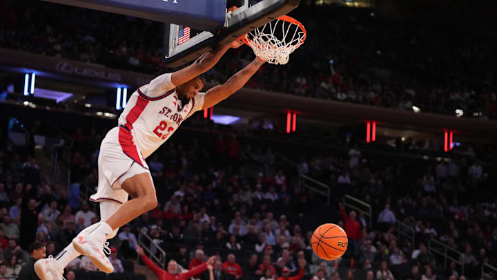 Mar 12, 2026; New York, NY, USA;  St. John's basketball forward Bryce Hopkins (23) dunks against the Providence Friars during the first half at Madison Square Garden.