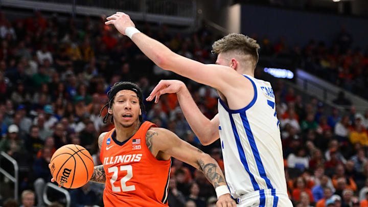 Mar 23, 2025; Milwaukee, WI, USA; Illinois Fighting Illini guard Tre White (22) drives against Kentucky Wildcats forward Andrew Carr (7) during the first half in the second round of the NCAA Tournament at Fiserv Forum. Mandatory Credit: Benny Sieu-Imagn Images Mar 23, 2025; Milwaukee, WI, USA; Illinois Fighting Illini guard Tre White (22) drives against Kentucky Wildcats forward Andrew Carr (7) during the first half in the second round of the NCAA Tournament at Fiserv Forum. Mandatory Credit: Benny Sieu-Imagn Images