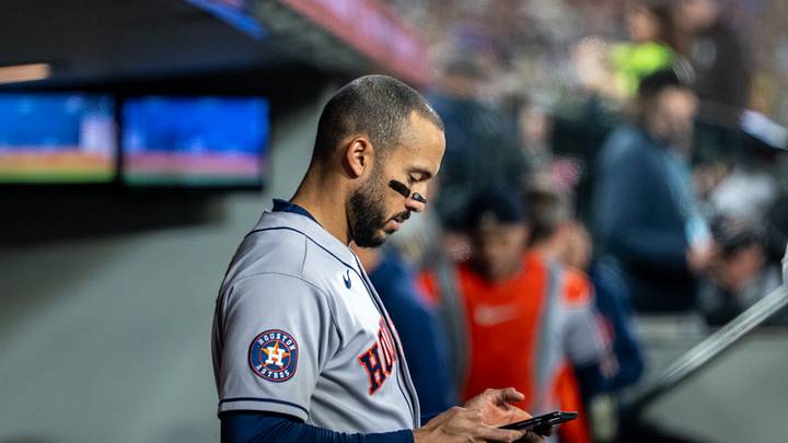 Apr 11, 2026; Seattle, Washington, USA;  Houston Astros infielder Carlos Correa (1) looks at a tablet device before a game against the Seattle Mariners at T-Mobile Park. Mandatory Credit: Stephen Brashear-Imagn Images