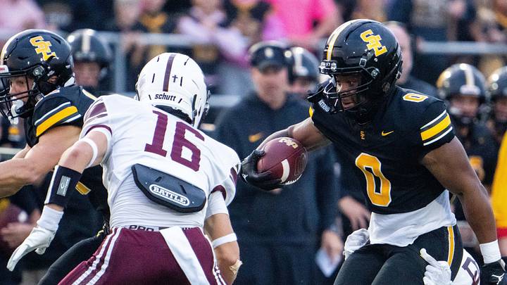 Southeast Polk's Stanley Cooper (0) looks to shake off his defender, Dowling Catholic's Grayson Pennington (23), on Sept. 18, 2026, at Southeast Polk High School. Southeast Polk's Stanley Cooper (0) looks to shake off his defender, Dowling Catholic's Grayson Pennington (23), on Sept. 18, 2026, at Southeast Polk High School.