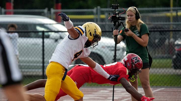 Mooney wide receiver CJ King (#2) is unable to pull in the pass at the goal line, defended by Aquinas defensive back Jaden Carey (#4). The Cardinal Mooney Catholic High School Cougars hosted the St. Thomas Aquinas High School Raiders in their first football game of the season Friday, Aug. 14, 2026 in Sarasota.