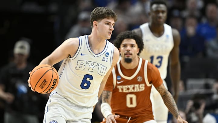 Mar 19, 2026; Portland, OR, USA; BYU Cougars guard Aleksej Kostic (6) dribbles against Texas Longhorns guard Jordan Pope (0) in the second half during a first round game of the men's 2026 NCAA Tournament at Moda Center. Mandatory Credit: Craig Strobeck-Imagn Images