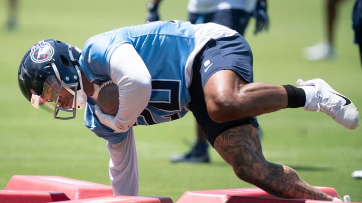 Running back Tony Pollard (20) runs through drills during the Tennessee Titans mandatory mini-camp at Ascension Saint Thomas Sports Park in Nashville, Tenn., Thursday, June 6, 2024.