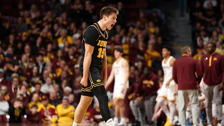 Jan 6, 2026; Minneapolis, Minnesota, USA; Iowa Hawkeyes guard Brendan Hausen (15) celebrates against the Minnesota Golden Gophers during the second half at Williams Arena. Mandatory Credit: Matt Krohn-Imagn Images
