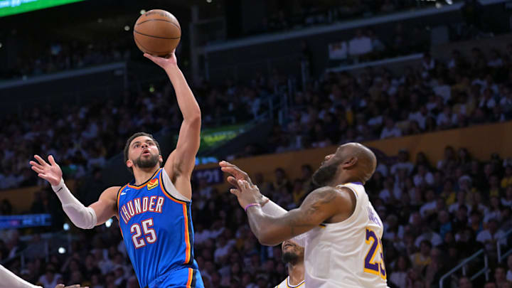May 9, 2026; Los Angeles, California, USA; Oklahoma City Thunder guard Ajay Mitchell (25) shoots over Los Angeles Lakers forward LeBron James (23) in the second half of game three of the second round of the 2026 NBA Playoffs at Crypto.com Arena.