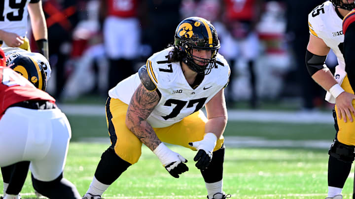 Iowa Hawkeyes offensive lineman Connor Colby (77)