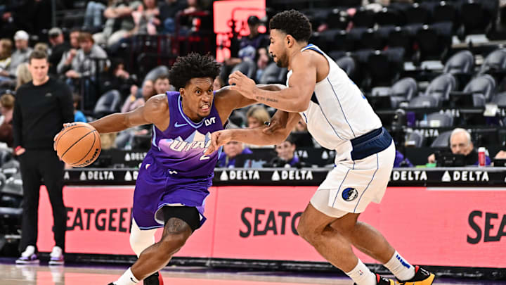 Nov 30, 2024; Salt Lake City, Utah, USA;  Utah Jazz guard Collin Sexton (2) drives around Dallas Mavericks guard Quentin Grimes (5) in the second half at Delta Center. Mandatory Credit: Jamie Sabau-Imagn Images