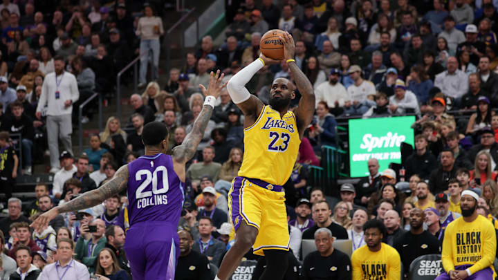 Feb 12, 2025; Salt Lake City, Utah, USA;  Los Angeles Lakers forward LeBron James (23) shoots over Utah Jazz forward John Collins (20) during the second quarter at Delta Center. Mandatory Credit: Chris Nicoll-Imagn Images