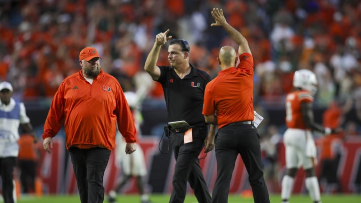 Sep 9, 2023; Miami Gardens, Florida, USA; Miami Hurricanes head coach Mario Cristobal celebrates after a touchdown against the Texas A&M Aggies during the fourth quarter at Hard Rock Stadium. Mandatory Credit: Sam Navarro-USA TODAY Sports Sep 9, 2023; Miami Gardens, Florida, USA; Miami Hurricanes head coach Mario Cristobal celebrates after a touchdown against the Texas A&M Aggies during the fourth quarter at Hard Rock Stadium. Mandatory Credit: Sam Navarro-USA TODAY Sports