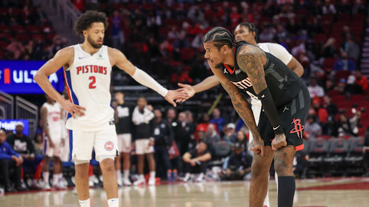 Jan 20, 2025; Houston, Texas, USA; Houston Rockets guard Jalen Green (4) looks on as Detroit Pistons guard Cade Cunningham (2) low fives forward Ausar Thompson (9)  in the second half at Toyota Center. Mandatory Credit: Thomas Shea-Imagn Images