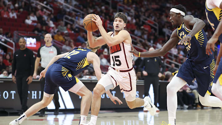 Nov 20, 2024; Houston, Texas, USA; Houston Rockets guard Reed Sheppard (15) attempts to drive with the ball past Indiana Pacers forward Johnny Furphy (12) during the second quarter at Toyota Center. Mandatory Credit: Troy Taormina-Imagn Images Nov 20, 2024; Houston, Texas, USA; Houston Rockets guard Reed Sheppard (15) attempts to drive with the ball past Indiana Pacers forward Johnny Furphy (12) during the second quarter at Toyota Center. Mandatory Credit: Troy Taormina-Imagn Images