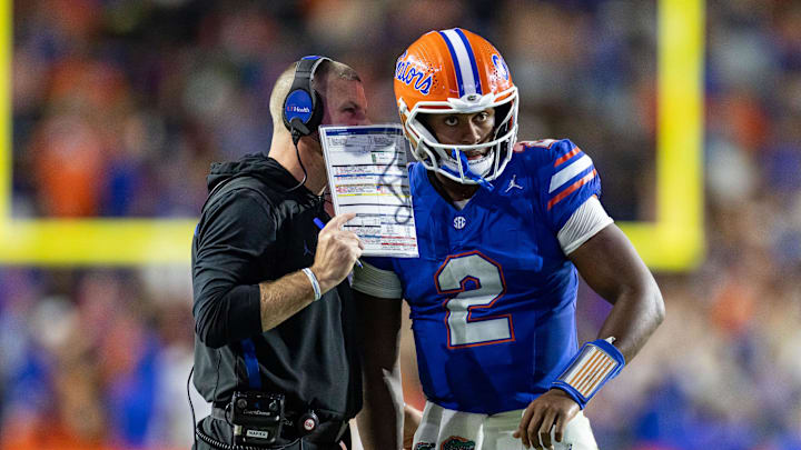 Oct 19, 2024; Gainesville, Florida, USA; Florida Gators head coach Billy Napier calls a play to Florida Gators quarterback DJ Lagway (2) against the Kentucky Wildcats during the second half at Ben Hill Griffin Stadium. Mandatory Credit: Matt Pendleton-Imagn Images