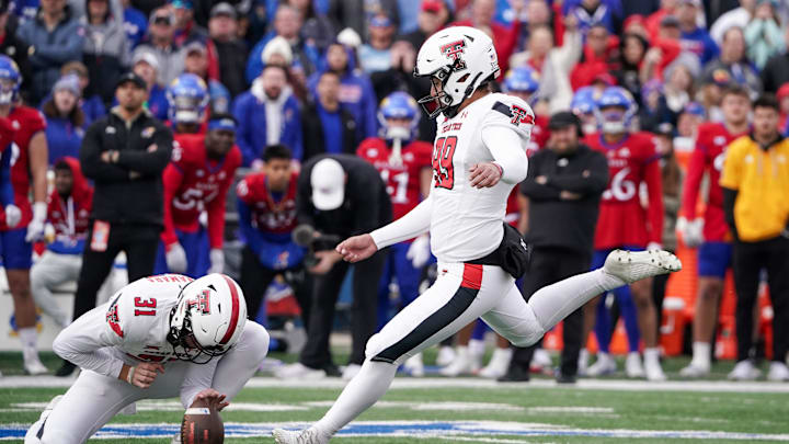 Nov 11, 2023; Lawrence, Kansas, USA; Texas Tech Red Raiders place kicker Gino Garcia kicks the game winning field goal against the Kansas Jayhawks during the second half at David Booth Kansas Memorial Stadium. Mandatory Credit: Denny Medley-Imagn Images