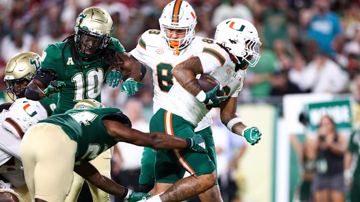 Sep 21, 2024; Tampa, Florida, USA; Miami Hurricanes running back Damien Martinez (6) score a touchdown against the South Florida Bulls in the third quarter at Raymond James Stadium. Mandatory Credit: Nathan Ray Seebeck-Imagn Images Sep 21, 2024; Tampa, Florida, USA; Miami Hurricanes running back Damien Martinez (6) score a touchdown against the South Florida Bulls in the third quarter at Raymond James Stadium. Mandatory Credit: Nathan Ray Seebeck-Imagn Images