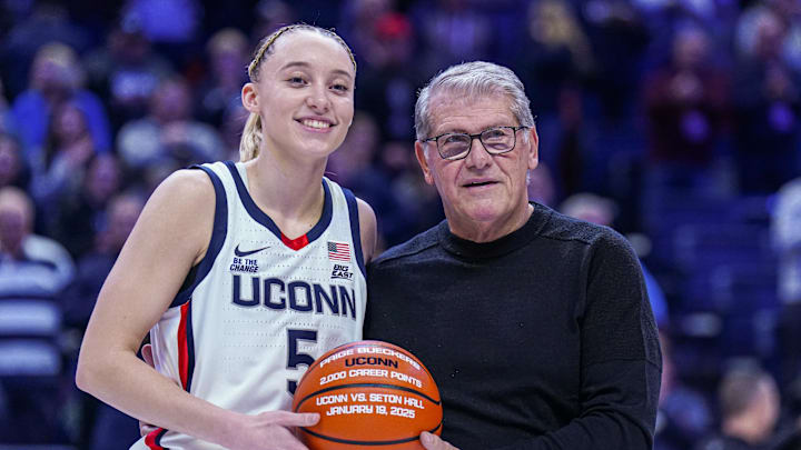 Jan 22, 2025; Storrs, Connecticut, USA; UConn Huskies guard Paige Bueckers (5) is recognized with head coach Geno Auriemma for her 2000 career points before the start of the game against the Villanova Wildcats at Harry A. Gampel Pavilion. Mandatory Credit: David Butler II-Imagn Images Jan 22, 2025; Storrs, Connecticut, USA; UConn Huskies guard Paige Bueckers (5) is recognized with head coach Geno Auriemma for her 2000 career points before the start of the game against the Villanova Wildcats at Harry A. Gampel Pavilion. Mandatory Credit: David Butler II-Imagn Images