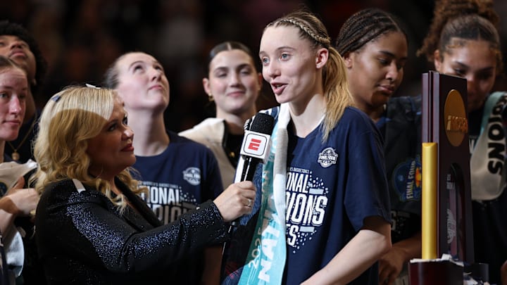 Apr 6, 2025; Tampa, FL, USA; Connecticut Huskies guard Paige Bueckers (5) is interviewed by ESPN reporter Holly Rowe after the national championship of the women's 2025 NCAA tournament against the South Carolina Gamecocks at Amalie Arena. Mandatory Credit: Nathan Ray Seebeck-Imagn Images