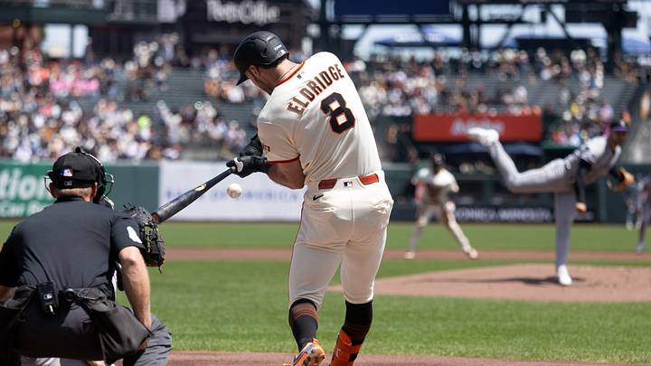 San Francisco, California, USA; San Francisco Giants first baseman Bryce Eldridge (8) connects for an RBI single against the Colorado Rockies during the first inning at Oracle Park. Mandatory Credit: D. Ross Cameron-Imagn Images