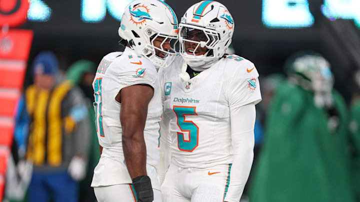 Jan 5, 2025; East Rutherford, New Jersey, USA; Miami Dolphins cornerback Jalen Ramsey (5) celebrates a defensive stop with linebacker Tyrel Dodson (11) during the first quarteragainst the New York Jets at MetLife Stadium. Mandatory Credit: Vincent Carchietta-Imagn Images Jan 5, 2025; East Rutherford, New Jersey, USA; Miami Dolphins cornerback Jalen Ramsey (5) celebrates a defensive stop with linebacker Tyrel Dodson (11) during the first quarteragainst the New York Jets at MetLife Stadium. Mandatory Credit: Vincent Carchietta-Imagn Images