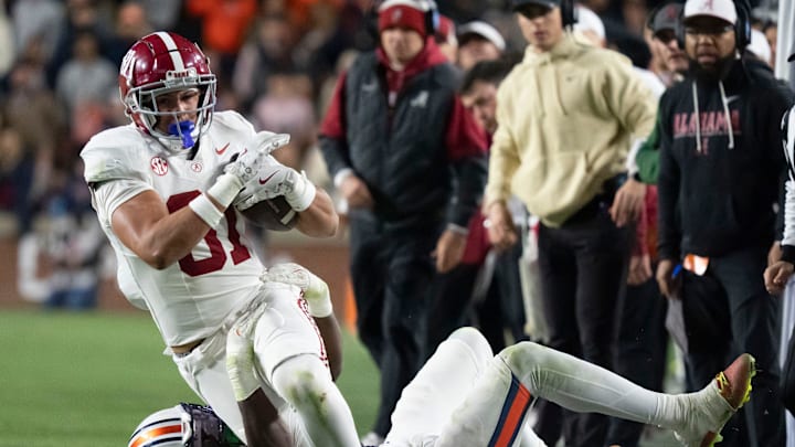 Nov 29, 2025; Auburn, Alabama, USA; Alabama tight end Kaleb Edwards (81) is brought down by an Auburn defender at Jordan-Hare Stadium. Alabama defeated Auburn 27-20. Mandatory Credit: Gary Cosby Jr.-Tuscaloosa News Nov 29, 2025; Auburn, Alabama, USA; Alabama tight end Kaleb Edwards (81) is brought down by an Auburn defender at Jordan-Hare Stadium. Alabama defeated Auburn 27-20. Mandatory Credit: Gary Cosby Jr.-Tuscaloosa News