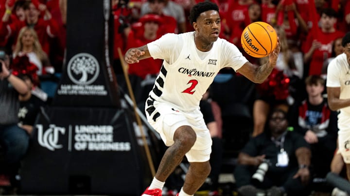 Cincinnati Bearcats guard Jizzle James (2) makes a steal in the first half of the NCAA Basketball game against the BYU Cougars at Fifth Third Arena in Cincinnati on Tuesday, March 3, 2026. Cincinnati Bearcats guard Jizzle James (2) makes a steal in the first half of the NCAA Basketball game against the BYU Cougars at Fifth Third Arena in Cincinnati on Tuesday, March 3, 2026.