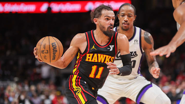 Nov 1, 2024; Atlanta, Georgia, USA; Atlanta Hawks guard Trae Young (11) drives on Sacramento Kings forward DeMar DeRozan (10) in the fourth quarter at State Farm Arena. Mandatory Credit: Brett Davis-Imagn Images
