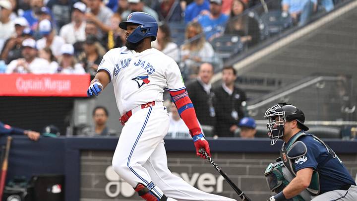 Aug 30, 2026; Toronto, Ontario, CAN;  Toronto Blue Jays first baseman Vladimir Guerrero Jr. (27) hits an RBI double against the Seattle Mariners in the fifth inning at Rogers Centre.  Mandatory Credit: Dan Hamilton-Imagn Images
