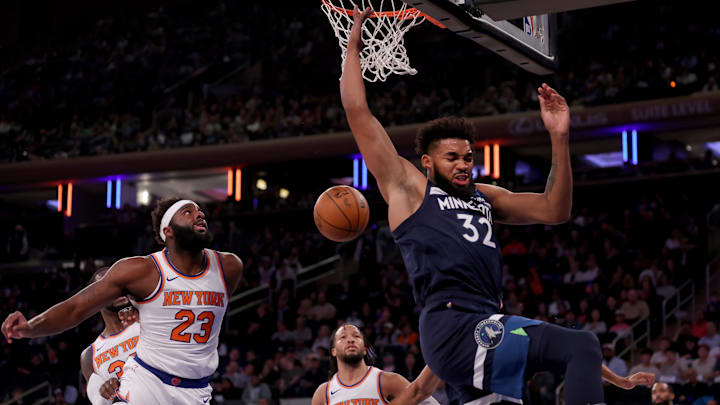 Oct 14, 2023; New York, New York, USA; Minnesota Timberwolves center Karl-Anthony Towns (32) reacts after a dunk against New York Knicks center Mitchell Robinson (23) and guard Jalen Brunson (11) during the first quarter at Madison Square Garden. Mandatory Credit: Brad Penner-Imagn Images