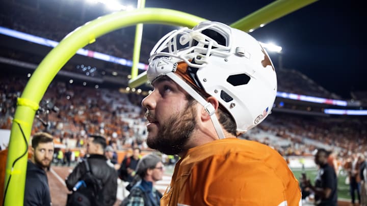 Dec 21, 2024; Austin, Texas, USA; Texas Longhorns offensive lineman Jake Majors (65) against the Clemson Tigers during the CFP National playoff first round at Darrell K Royal-Texas Memorial Stadium. Mandatory Credit: Mark J. Rebilas-Imagn Images