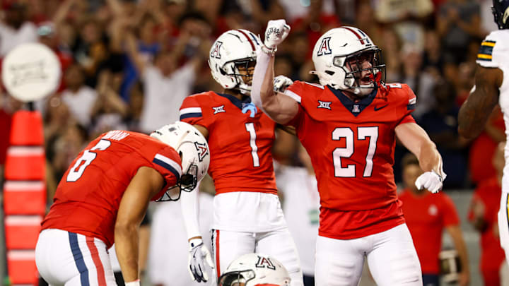 Sep 7, 2024; Tucson, Arizona, USA; Arizona Wildcats defensive back Owen Goss (27) celebrates tackle made against Northern Arizona Lumberjack during fourth quarter at Arizona Stadium. Mandatory Credit: Aryanna Frank-Imagn Images