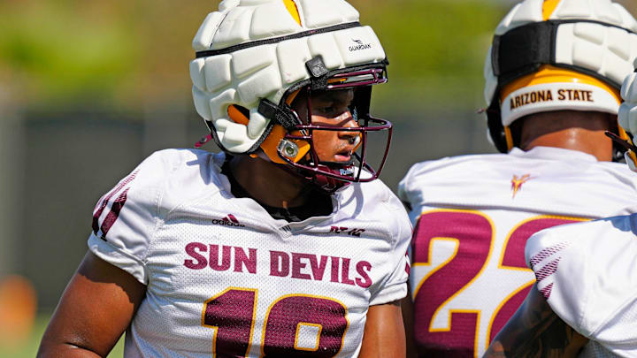 ASU linebacker Martell Hughes (18) warms up during practice in Tempe on July 31, 2024.